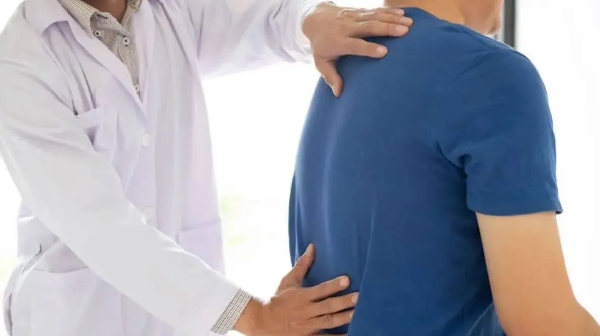 Doctor in Back Pain
